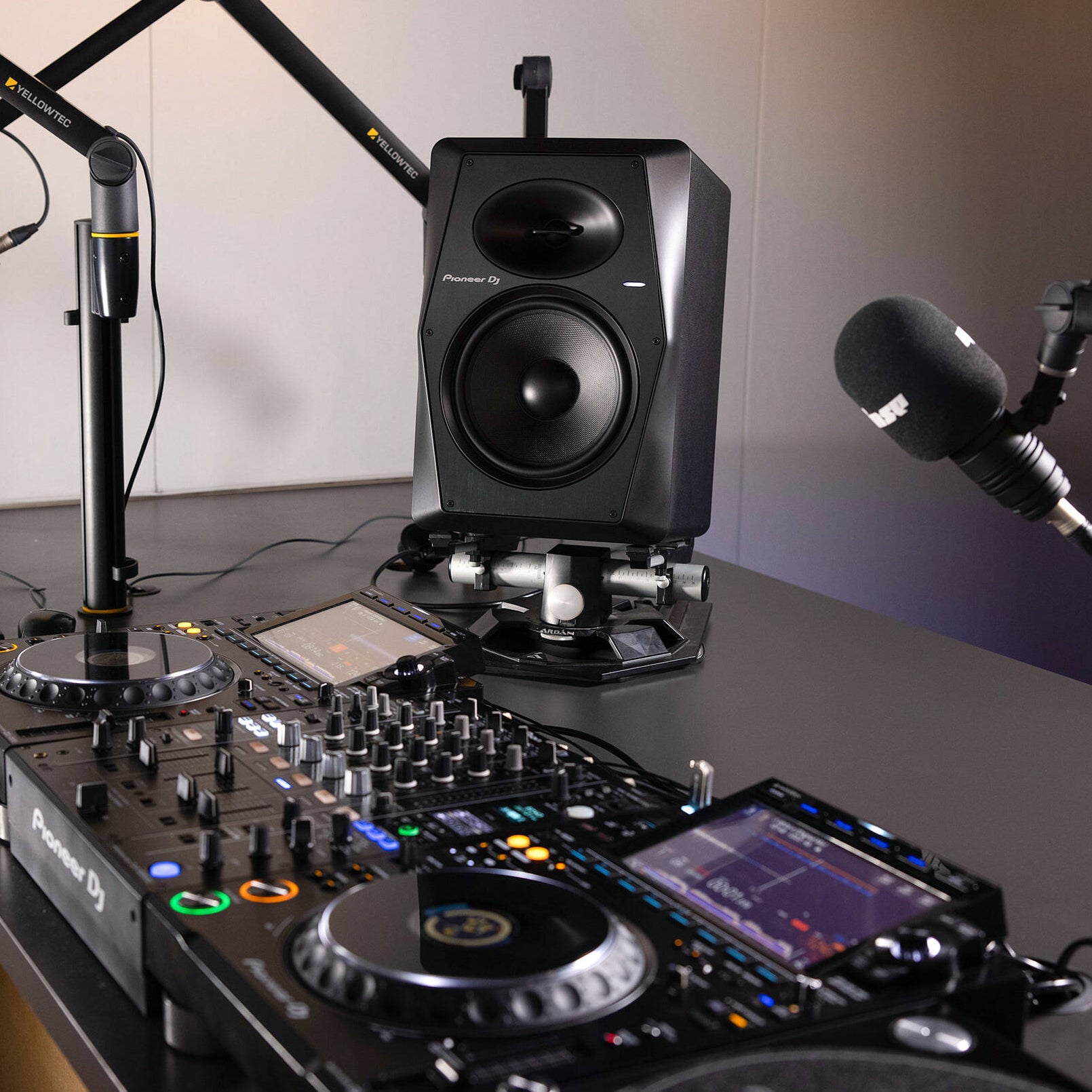 Pioneer DJ VM-70 studio monitors in black with front-facing speaker and sleek design, ideal for professional audio setups.