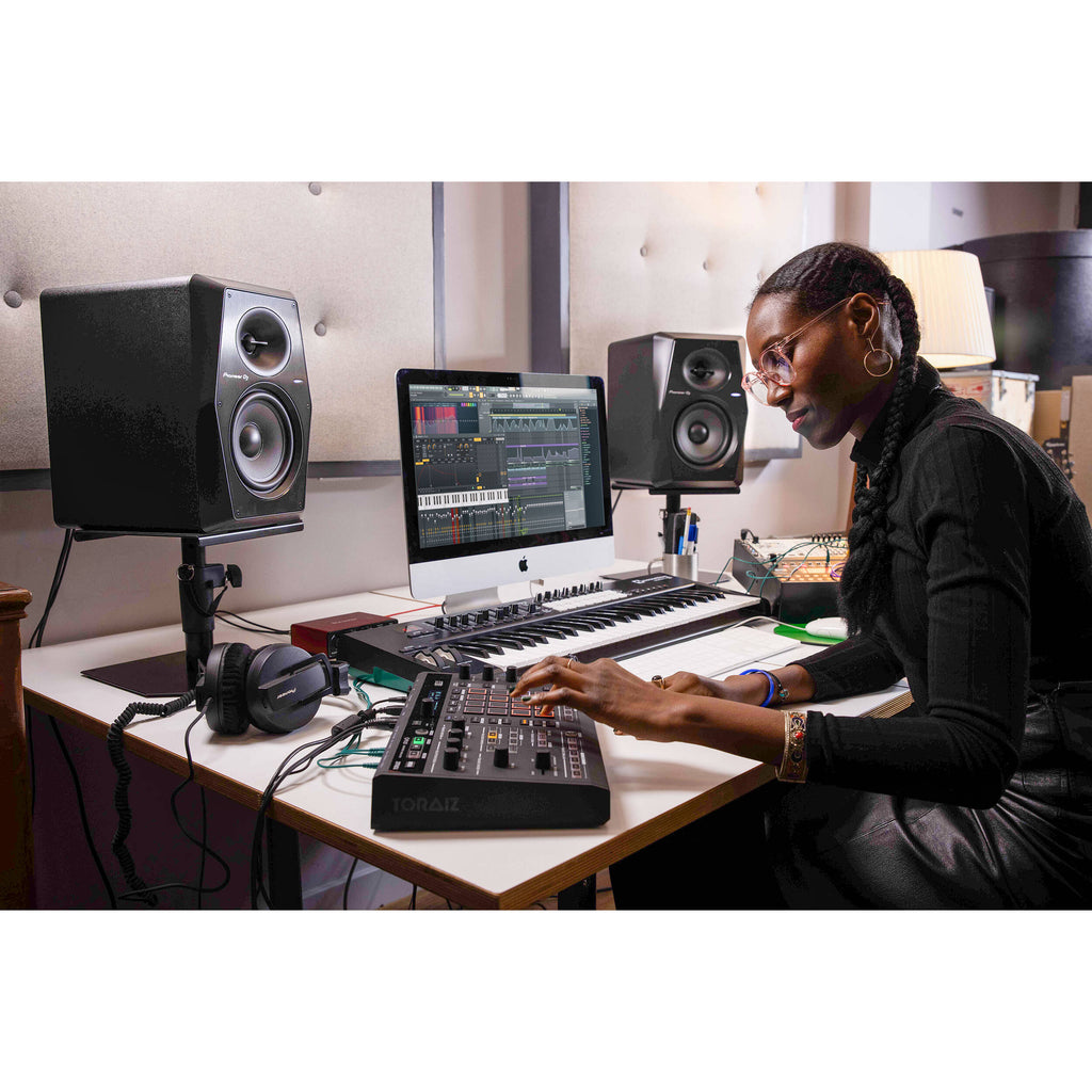 Pioneer DJ VM-70 studio monitors in black, showcasing sleek design and professional audio features.