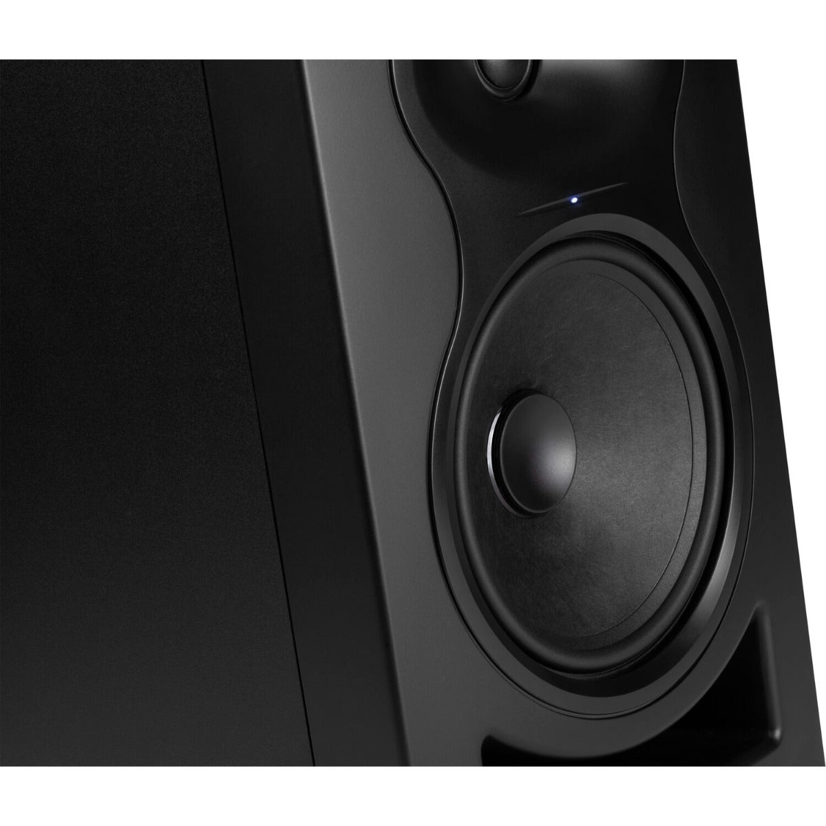 Kali Audio LP-6 V2 active nearfield monitors set on a desk with a neutral background, showcasing their sleek black design.