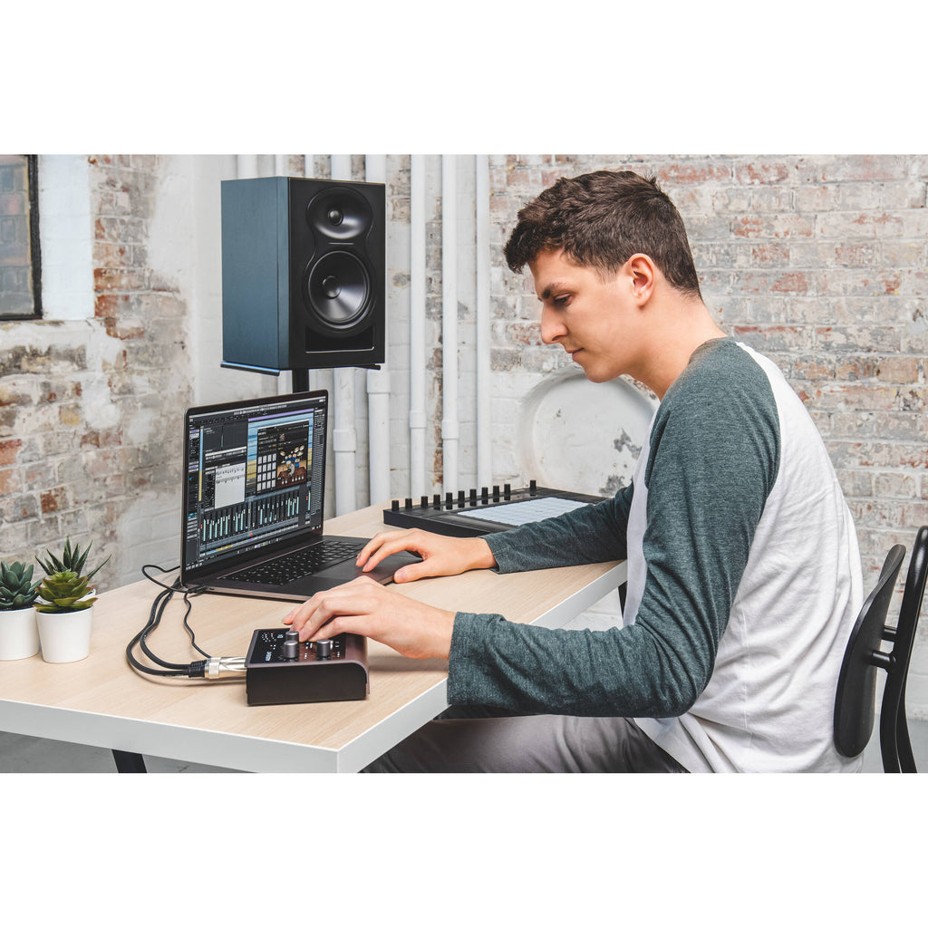 Audient iD4 MK2 audio interface with compact design, front panel input jacks, and control knobs for professional audio recording.