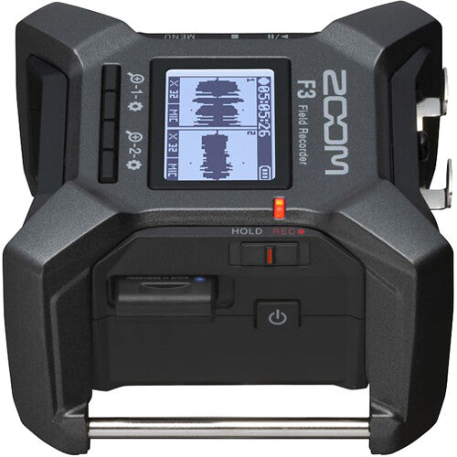 Zoom F3 digital recorder with multiple input channels and control buttons, showing a compact portable recording device.