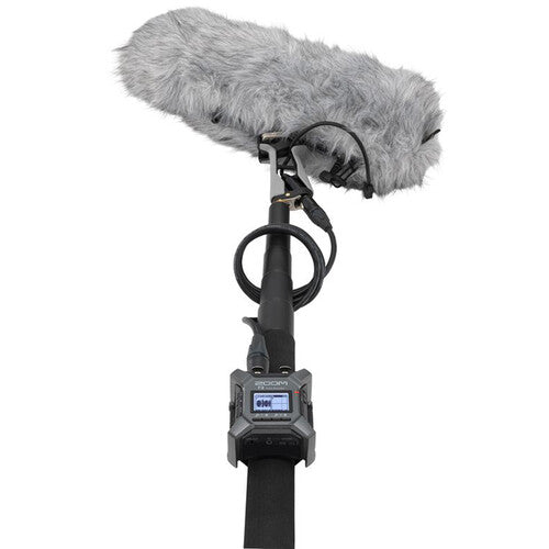 Zoom F3 digital recorder with multiple input options and compact design, ideal for professional audio recording.