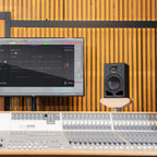 Adam Audio A7V active nearfield monitor showing its sleek black speaker with brand logo and detailed front grille.