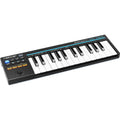 Nektar Impact GX Mini midi keyboard with black keys and control knobs, compact design for music production and performance.