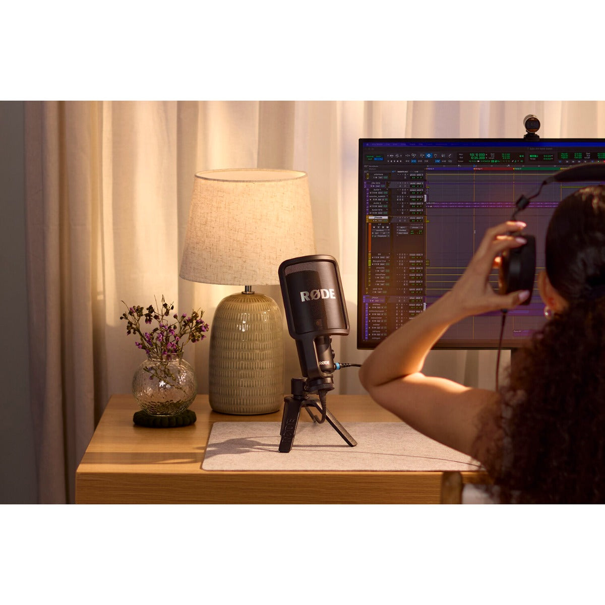 Rode NT-USB+ USB microphone with built-in stand and controls, ideal for podcasting, streaming, and recording.