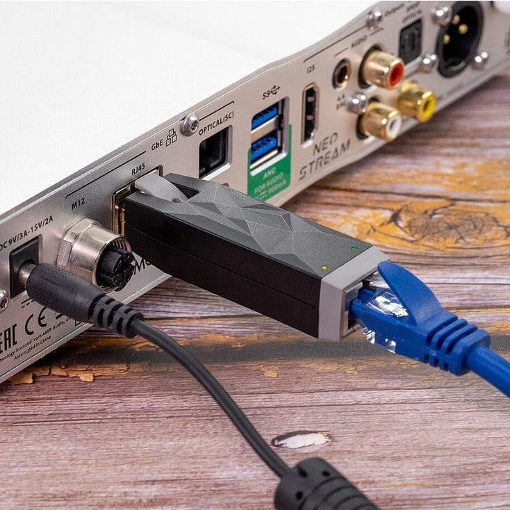 SilentPower LAN iSilencer noise filter and conditioner with sleek design, showing ports and connectors in clear view.