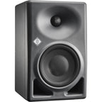 Neumann KH 120 II active nearfield studio monitors set on a desk with audio equipment in a professional recording studio.