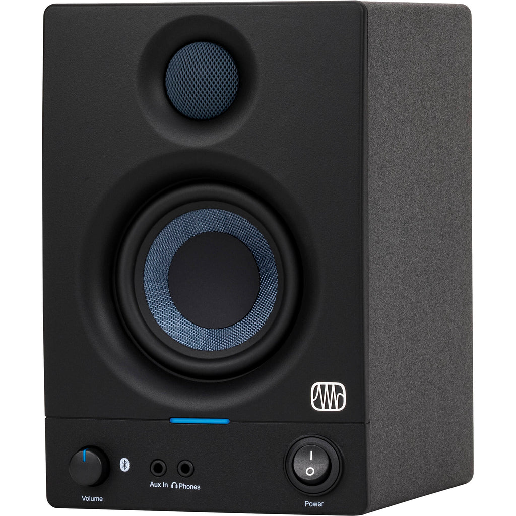 Presonus Eris 3.5 BT 2nd Gen active nearfield monitors on a desk, showing sleek black design and control knobs.