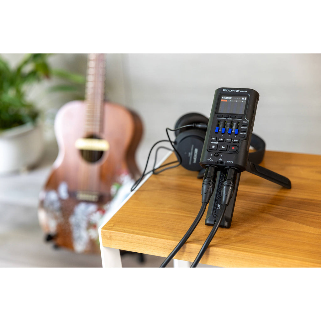 Zoom R4 MultiTrak digital recorder with four input channels, LCD screen, and multiple control knobs for versatile audio recording.
