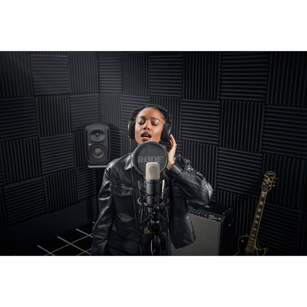 Rode NT1 Signature Series condenser microphone with silver finish and shock mount, designed for professional studio recording.