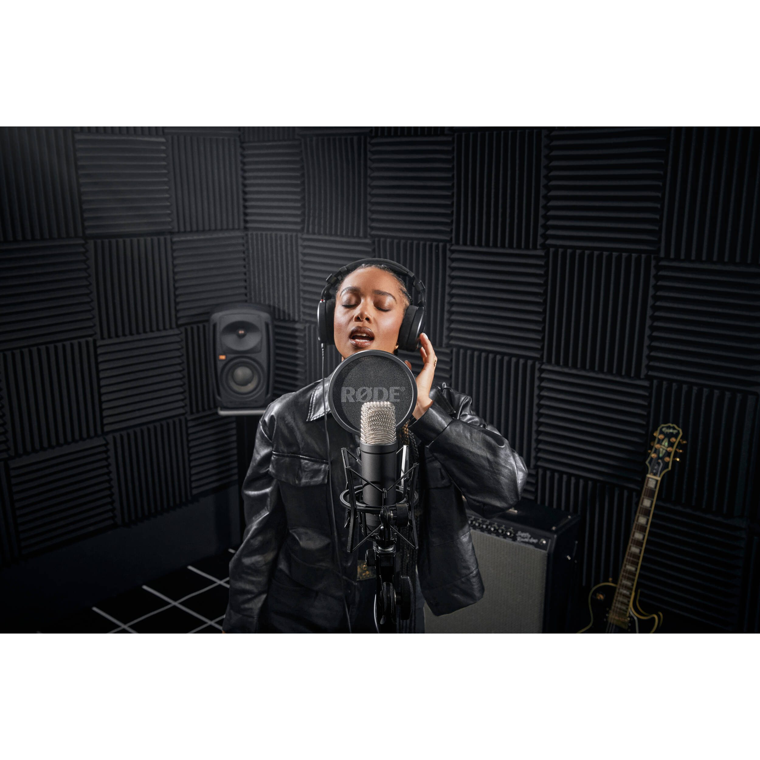 Rode NT1 Signature Series condenser microphone with silver finish and shock mount, designed for professional studio recording.