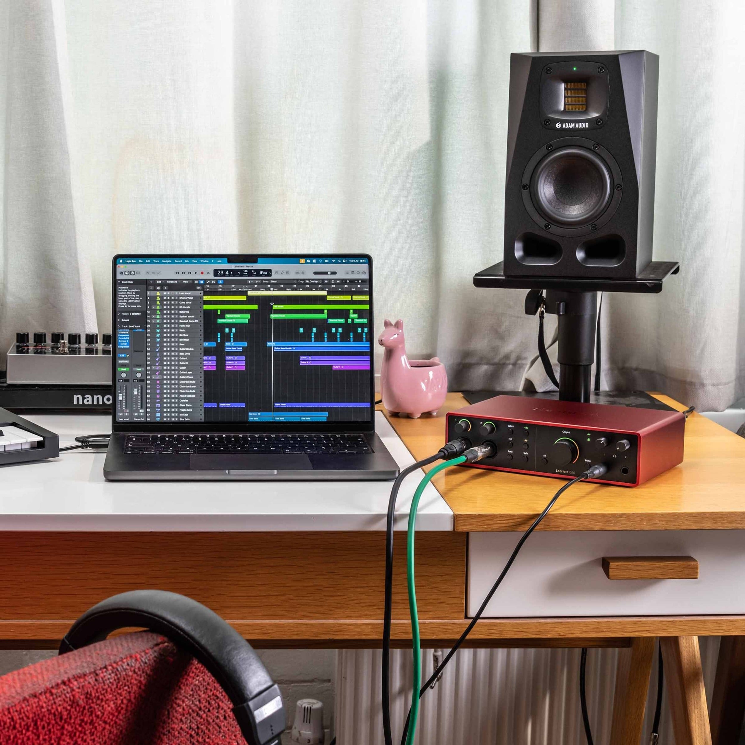 Focusrite Scarlett 16i16 4th Gen audio interface with multiple input and output ports, black and orange design, and control knobs.