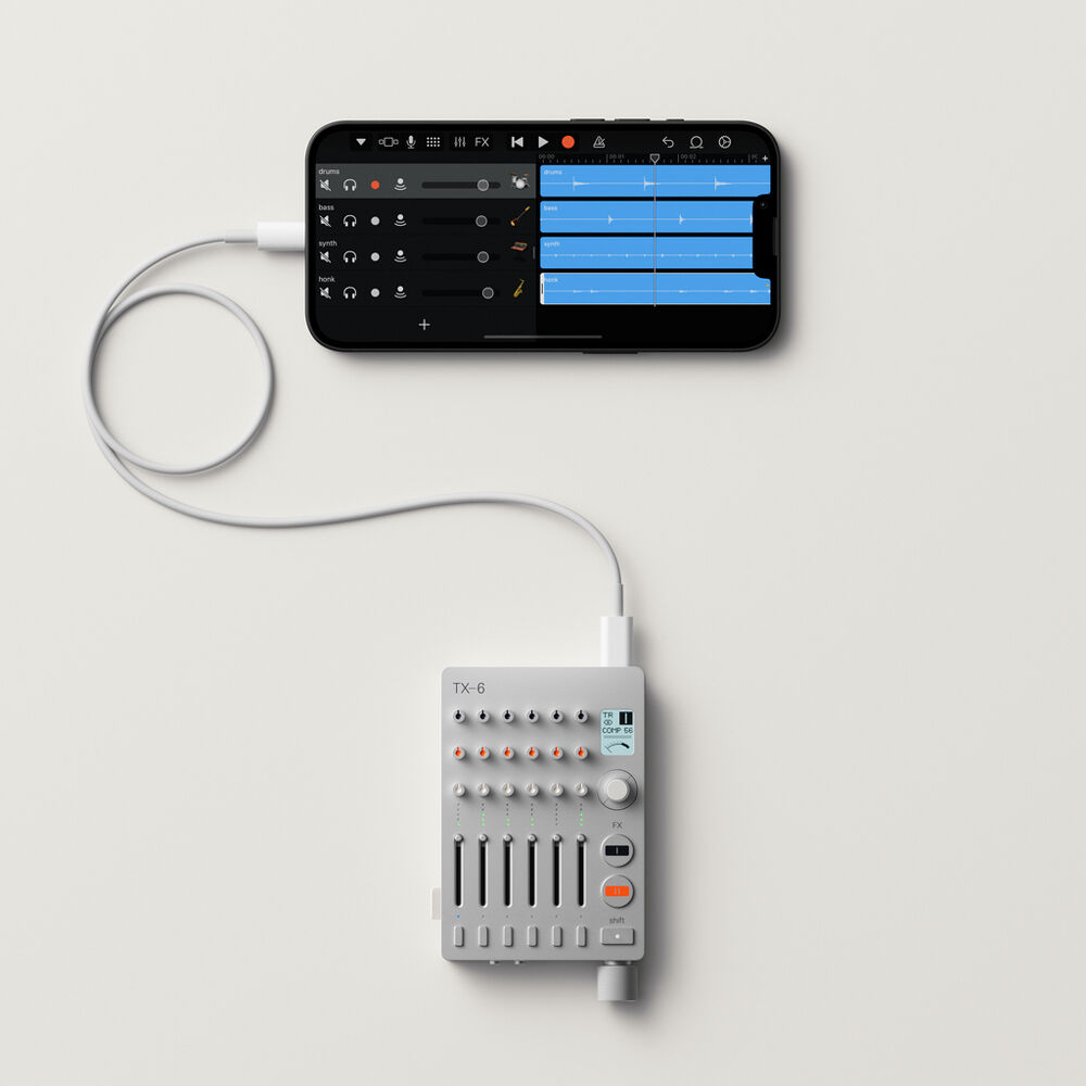 Teenage Engineering TX–6 portable mixer with multiple input channels and compact design, ideal for audio mixing and production.