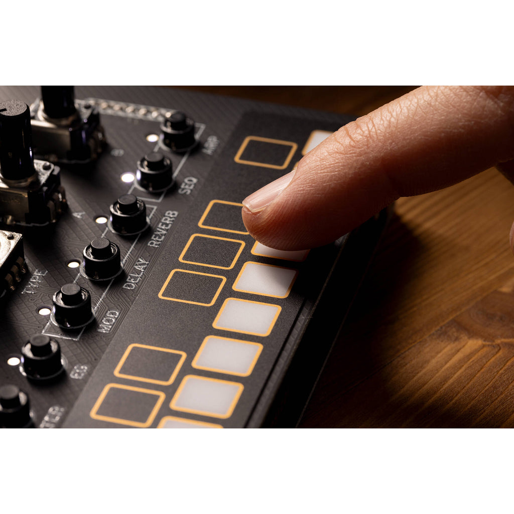 Korg Nu:Tekt NTS-1 MK2 digital synthesizer kit with compact design and various control knobs, ready for music creation.