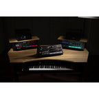 Korg Opsix synthesizer module with colorful control interface and knobs, designed for electronic music production.
