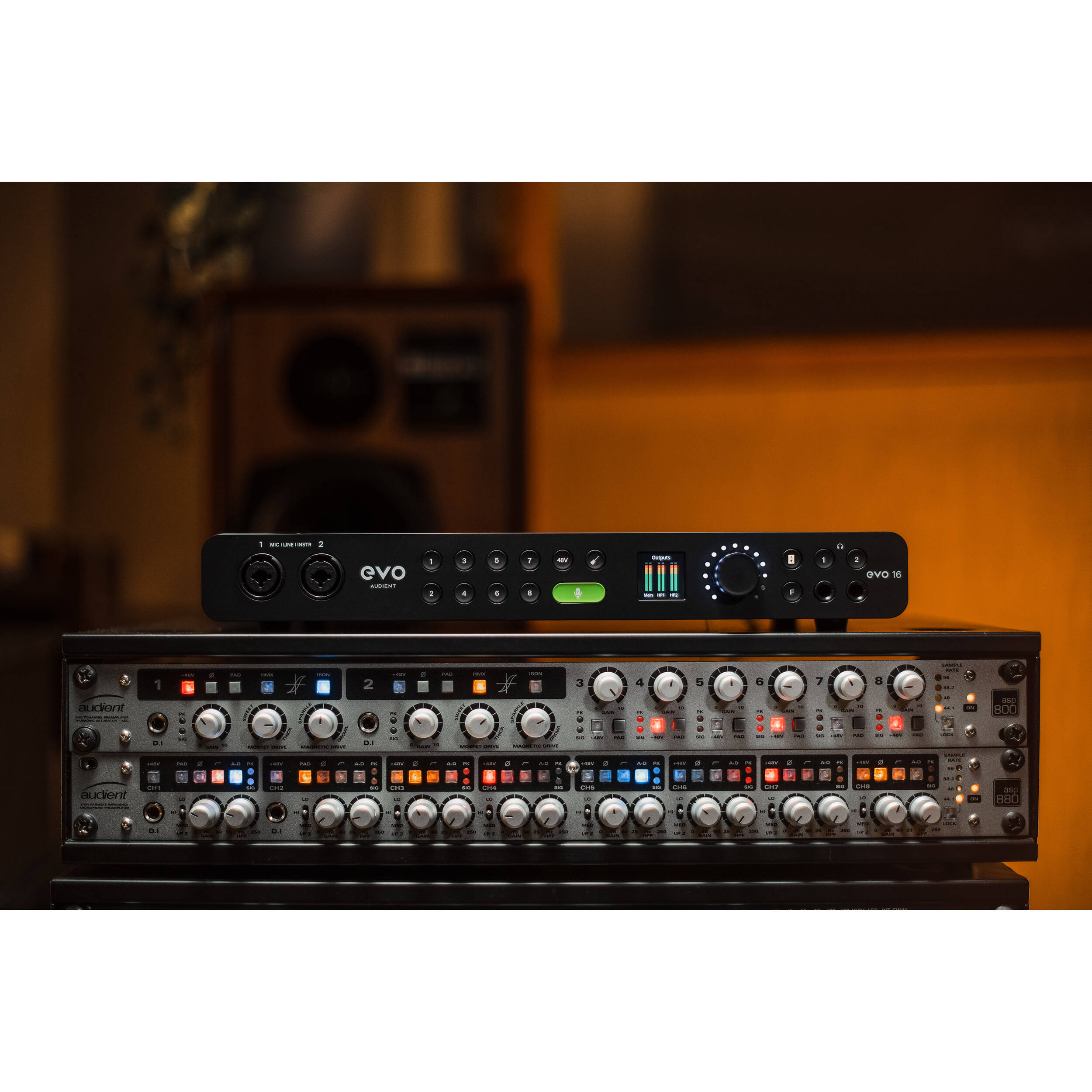 Audient EVO 16 audio interface with multiple input and output ports, black metal casing, and control knobs on a desk setup.