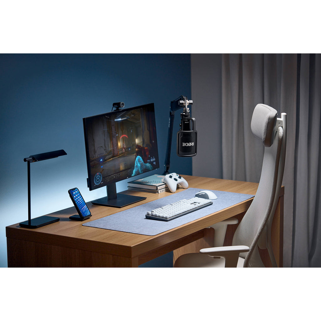 Rode NT-USB+ USB microphone with built-in stand and controls, ideal for podcasting, streaming, and recording at a desk.