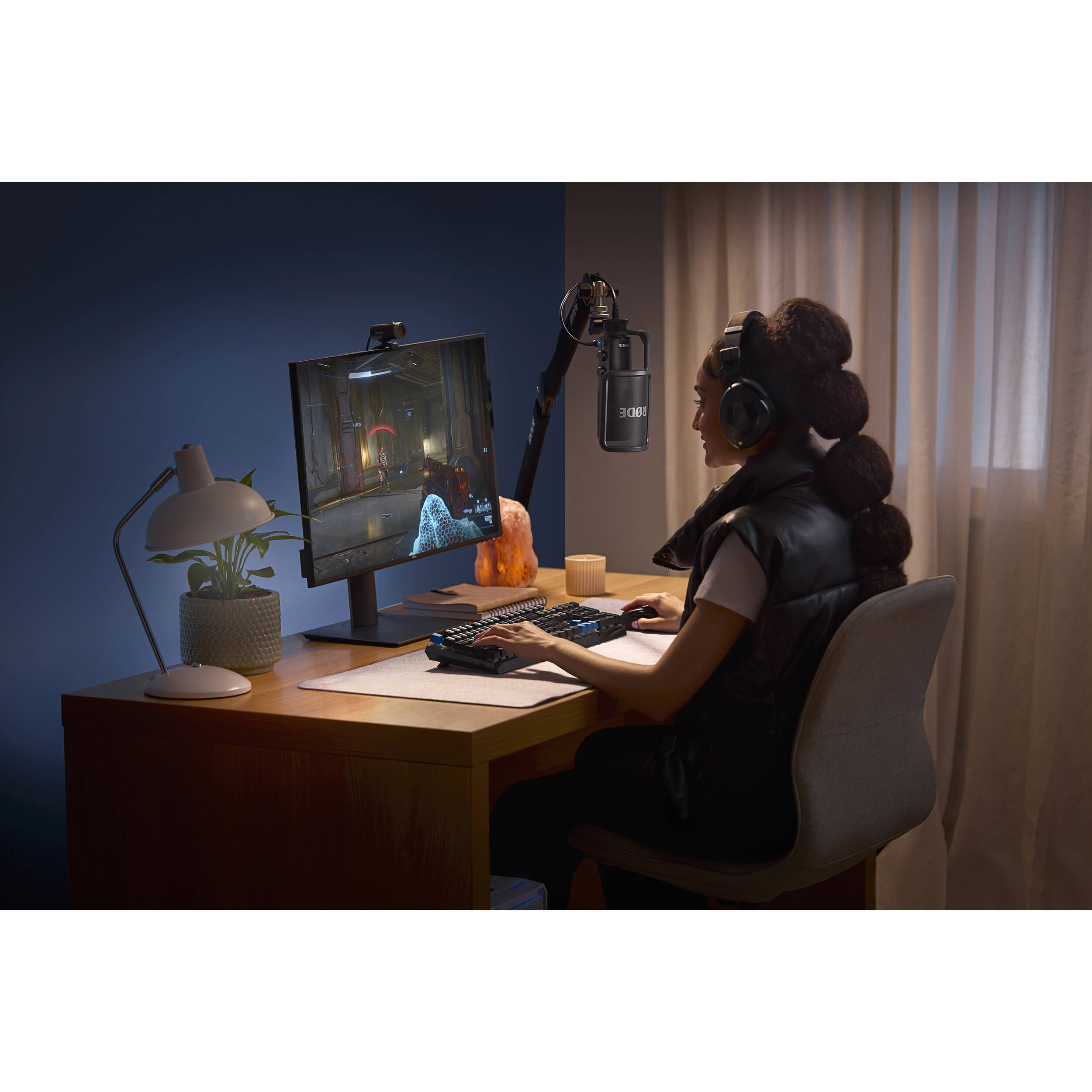 Rode NT-USB+ USB microphone with built-in stand and controls, ideal for podcasting, streaming, and recording at a desk.