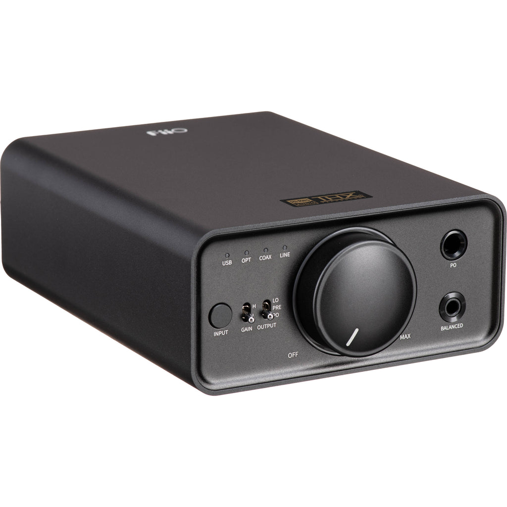 FiiO K7 headphone amplifier and DAC with sleek black design and multiple input/output ports on the front and back.