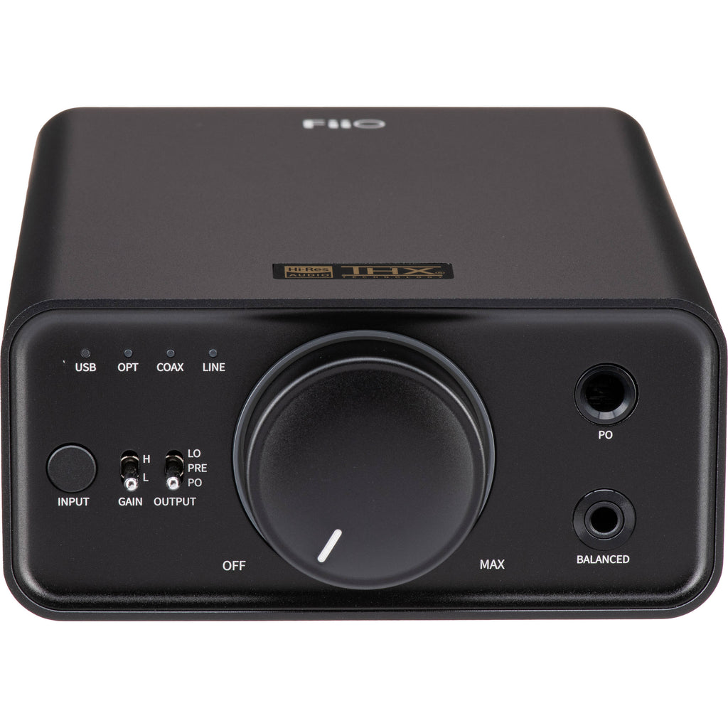 FiiO K7 headphone amplifier and DAC with sleek black design and multiple input ports on a white background.