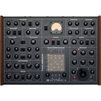 Erica Synths SYNTRX II desktop synthesizer with colorful knobs and controls, compact design, and patch points for sound creation.