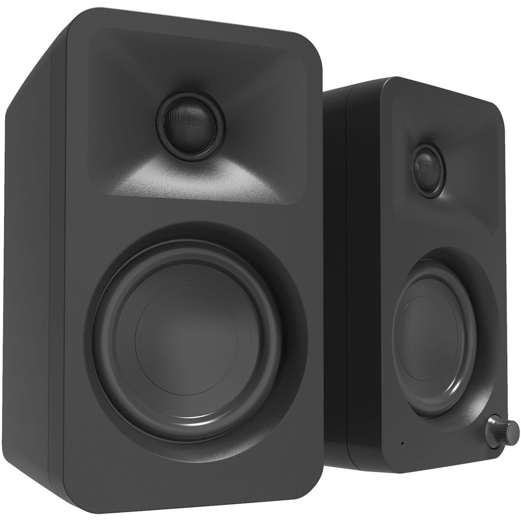 Kanto Audio Ora desktop speakers in black with sleek design and dual speaker setup on a minimalist desk.