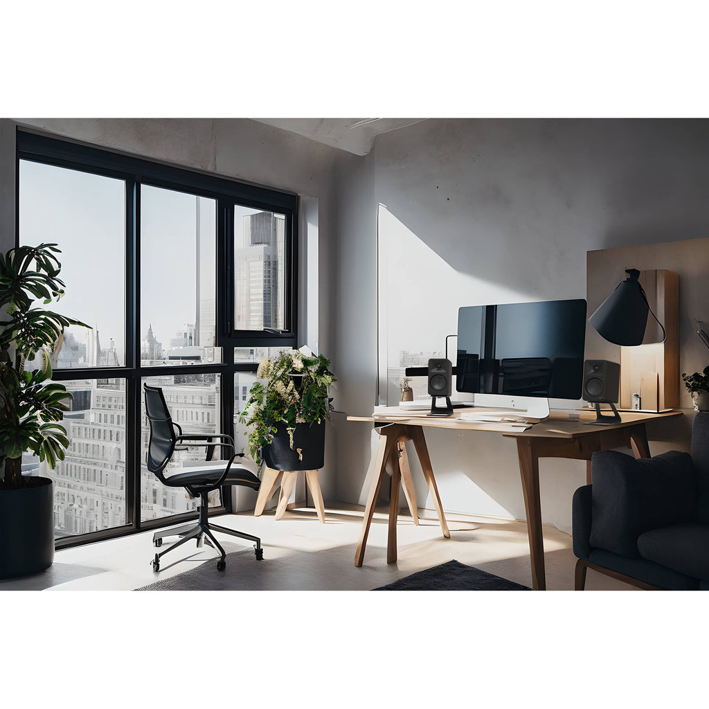 Kanto Audio Ora desktop speakers with sleek black finish and modern design, ideal for high-quality audio on a desk setup.