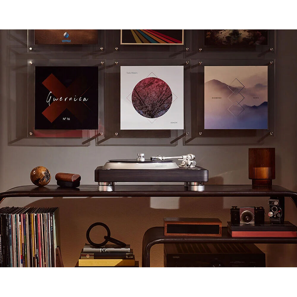 Denon DP-3000NE turntable with black finish, featuring tonearm, platter, and control buttons for high-quality vinyl playback.