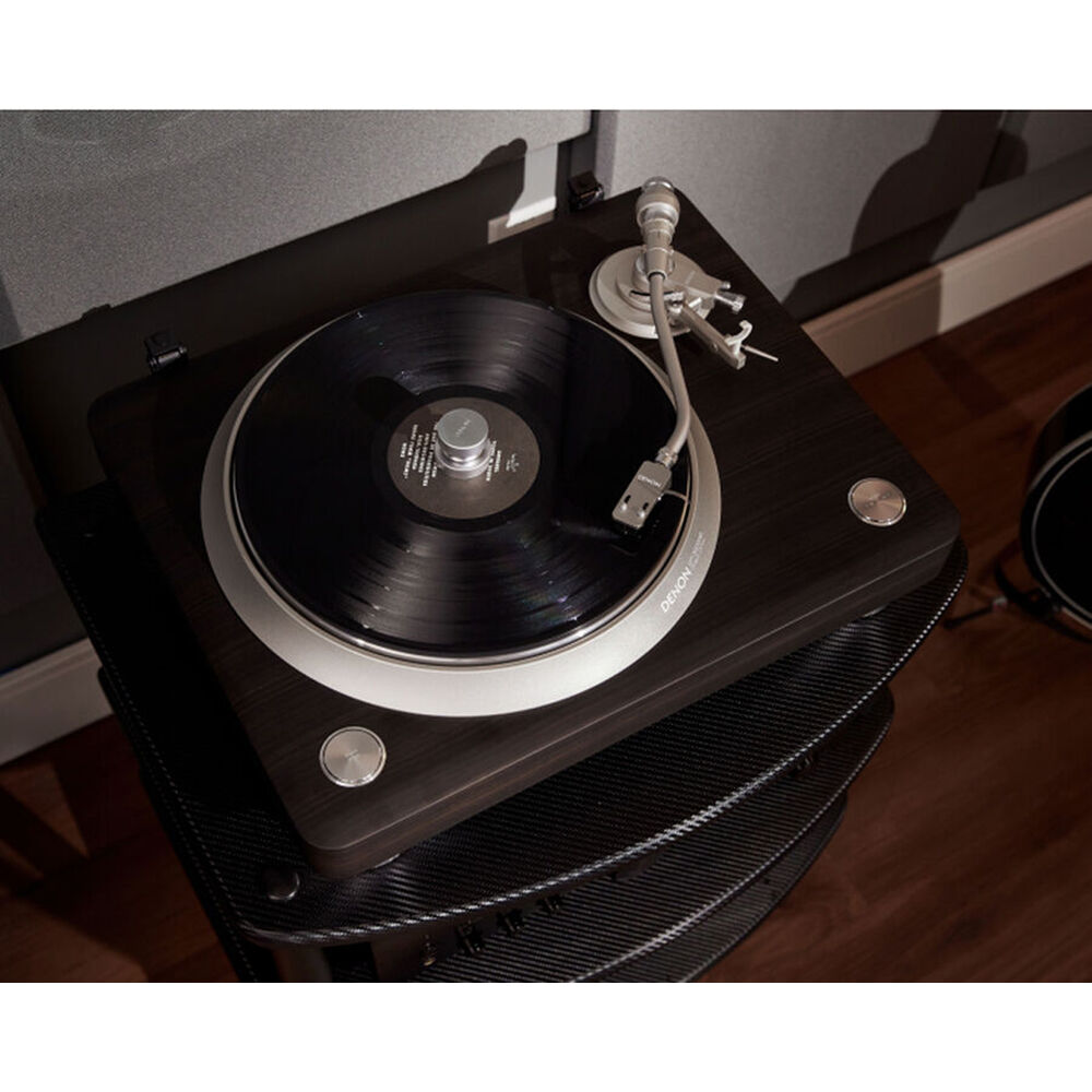 Denon DP-3000NE turntable with wooden plinth and tonearm, showcasing a sleek design for high-quality vinyl playback.