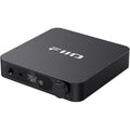 FiiO K11 headphone amplifier and DAC with sleek black design, multiple input ports, and digital display on the front panel.