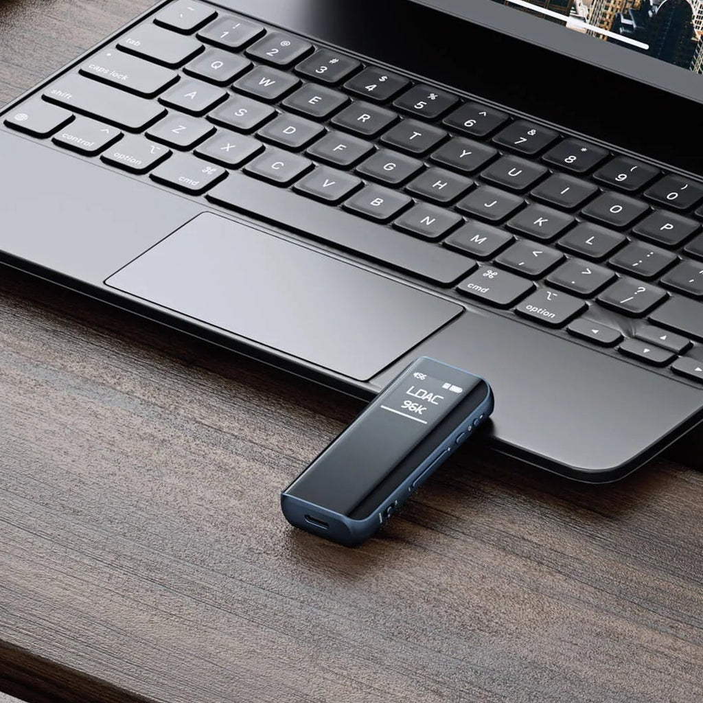 FiiO BTR15 portable headphone amplifier and DAC with sleek black design and visible control buttons.