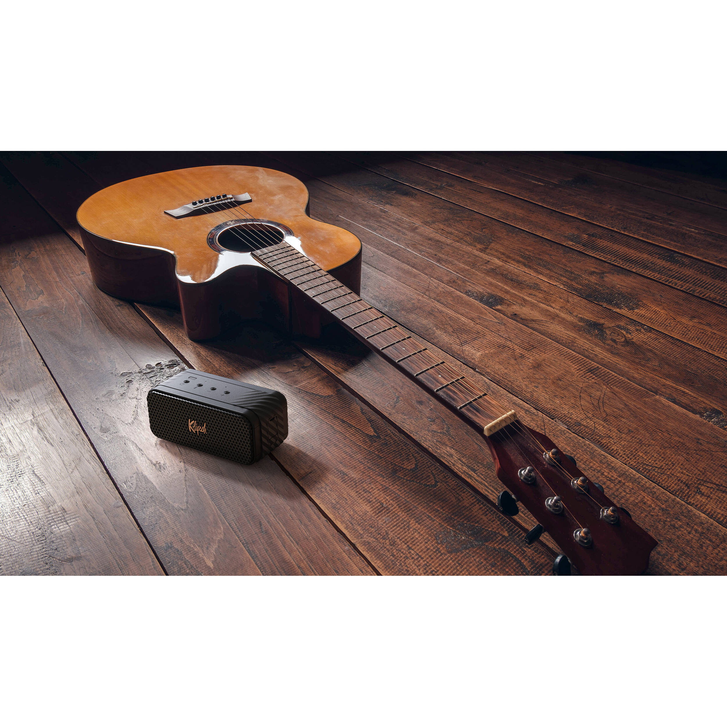 Klipsch Nashville portable speaker with sleek design, featuring control buttons and fabric grille, ideal for on-the-go audio.