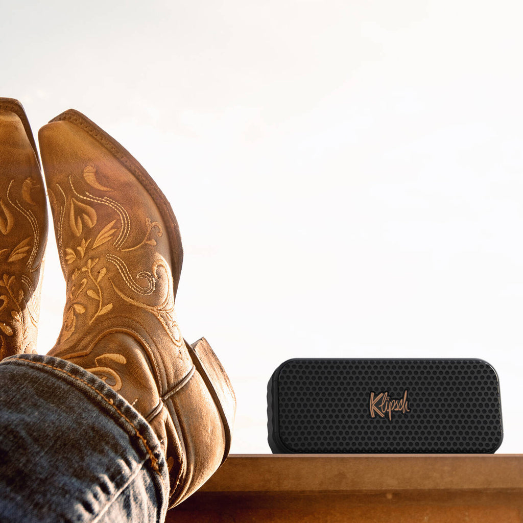 Klipsch Nashville portable speaker with sleek black design, compact size, and textured exterior for high-quality sound.