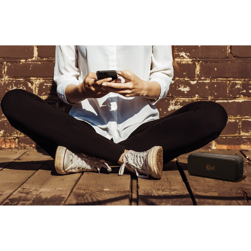 Klipsch Nashville portable speaker with black design, featuring a compact shape and control buttons on the top panel.