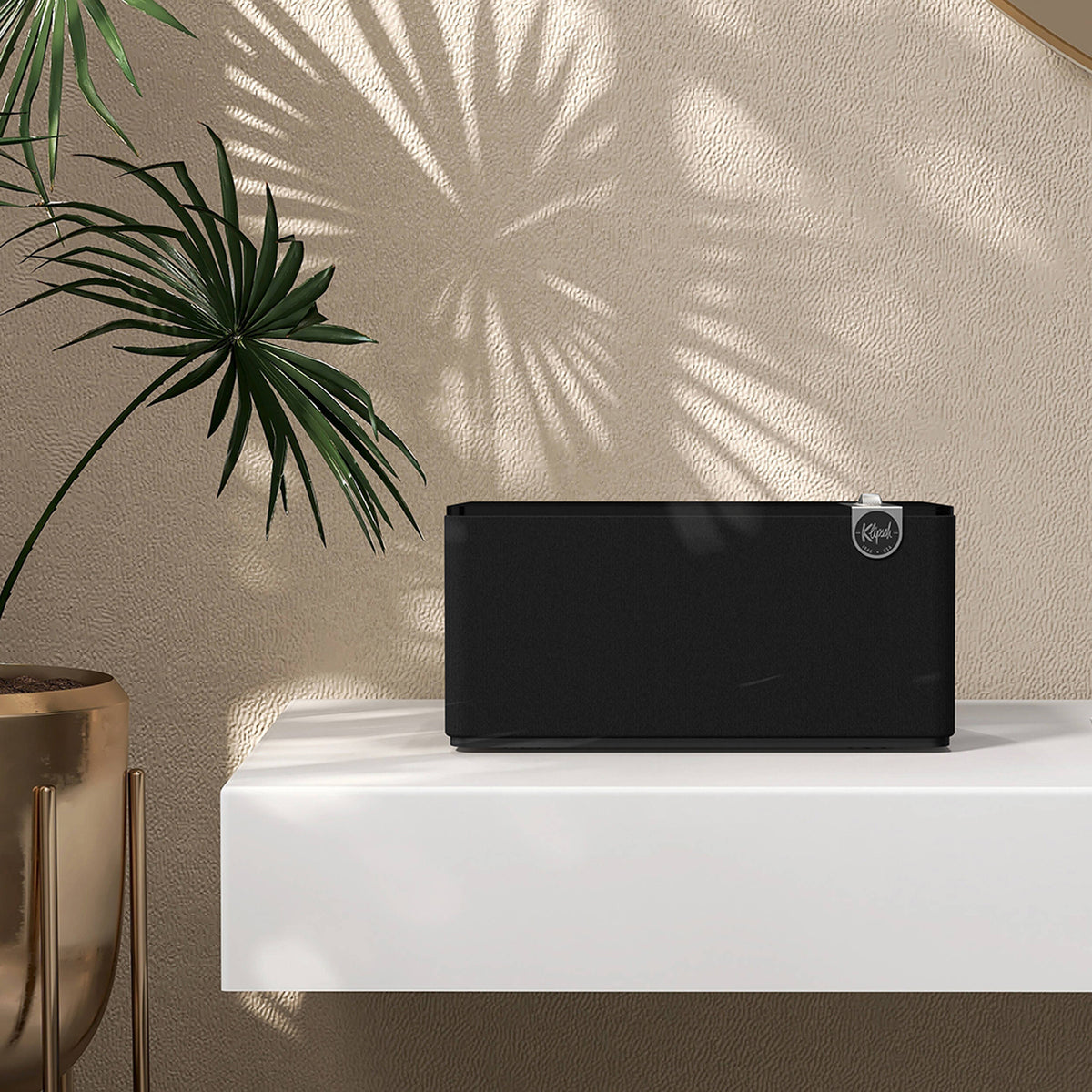 Wireless Klipsch The Three Plus speaker with wooden cabinet and control knobs, showcasing its vintage-inspired design.