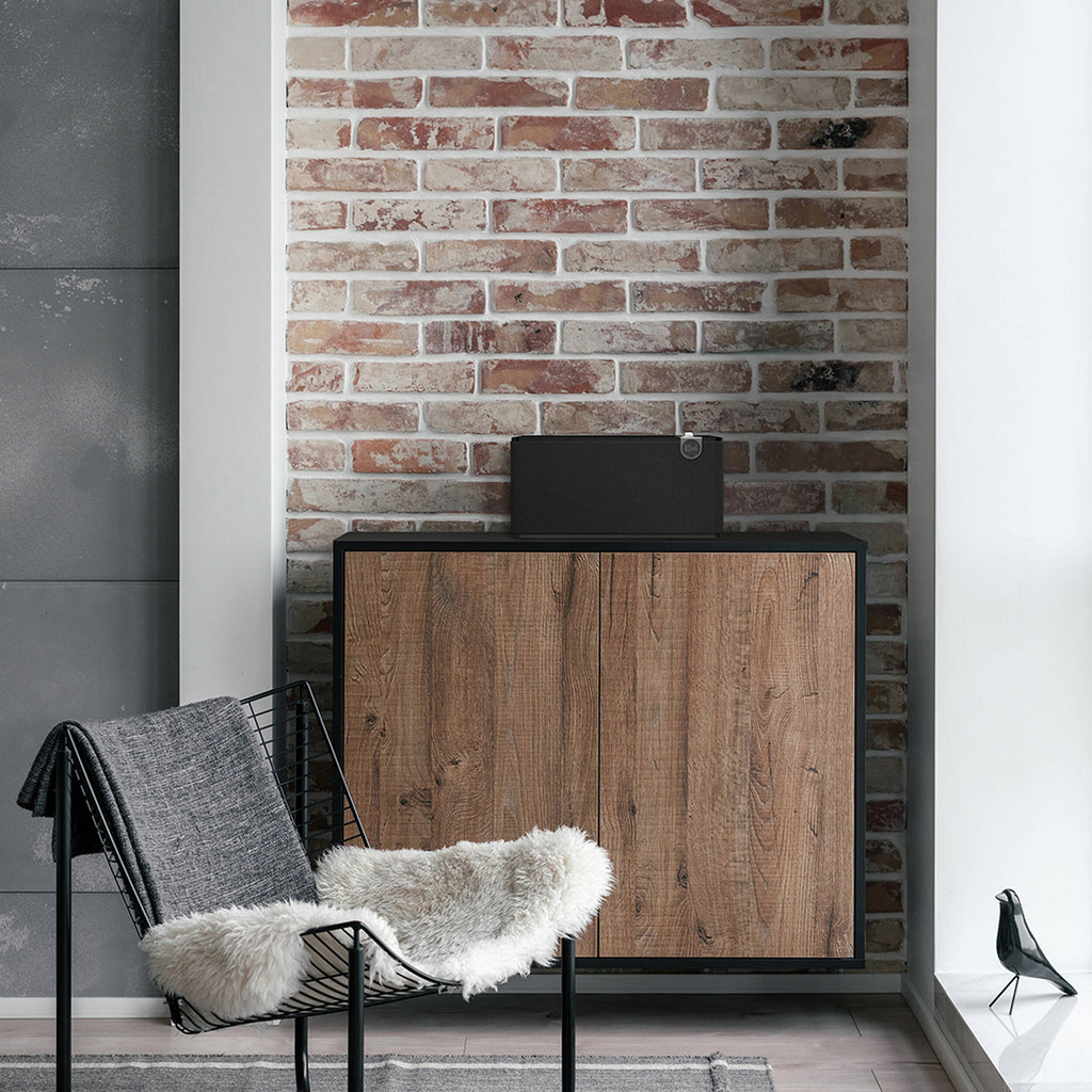 Klipsch The Three Plus wireless speaker with wooden cabinet and vintage-inspired design, featuring control knobs and a digital display.