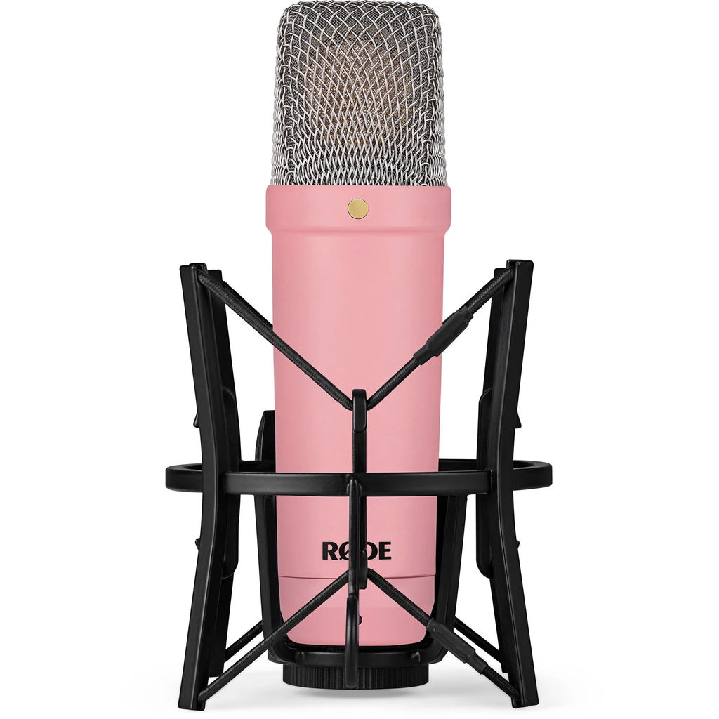 Rode NT1 Signature Series condenser microphone with black body and gold accents, positioned on a stand for studio recording.