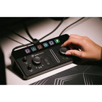 Mackie MainStream video streaming device with control interface, featuring buttons and display screen for live streaming setup.