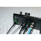 Mackie MainStream video streaming device with control interface, black rectangular design, and multiple connection ports.