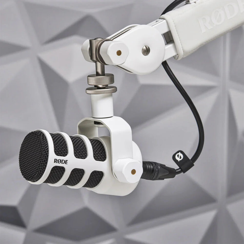 Rode PodMic dynamic microphone with metal grille and black body, ideal for podcasting and broadcasting.