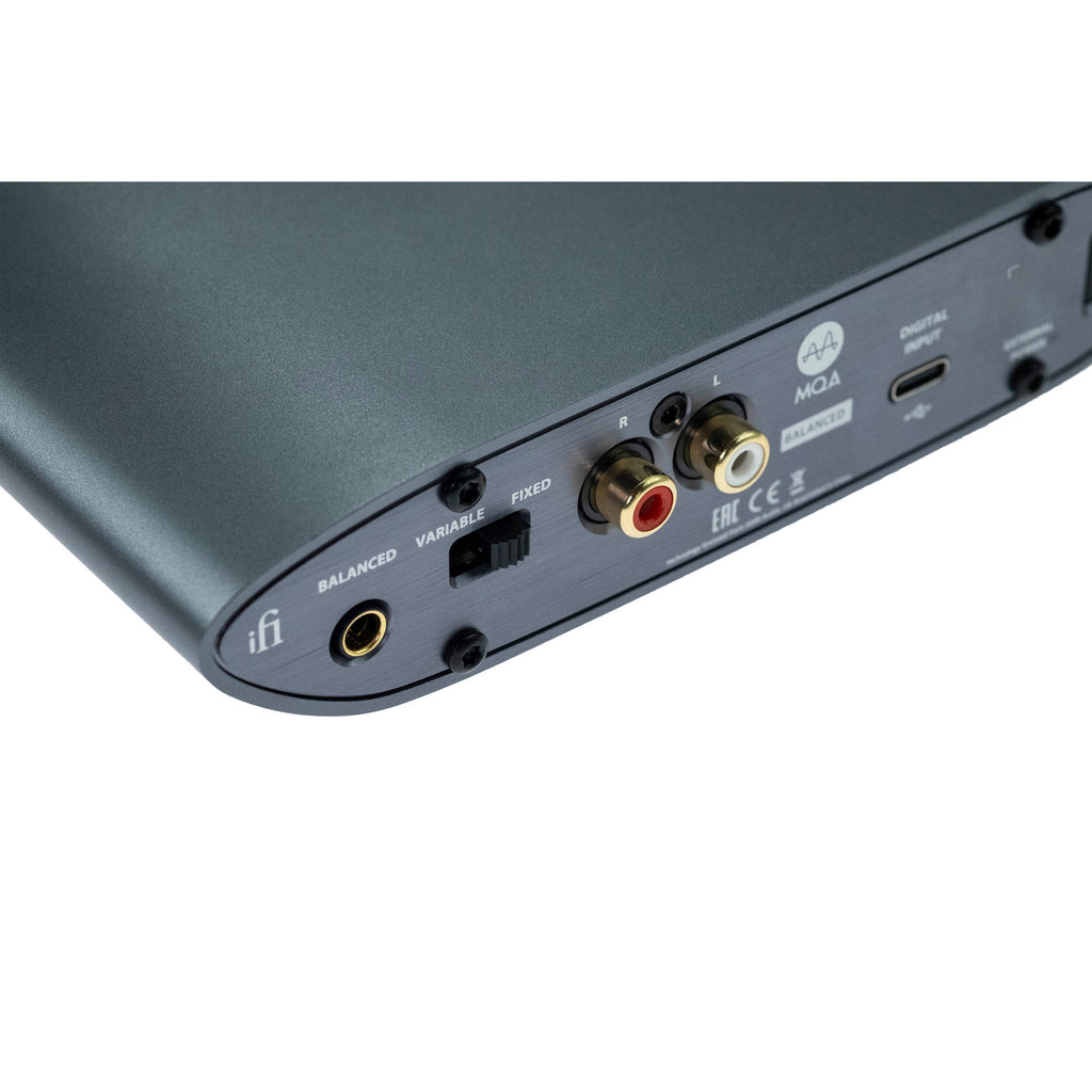iFi Audio Zen Dac 3 headphone amplifier and DAC with sleek black design and multiple input ports on a wooden surface