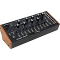 Moog Spectravox synthesizer with colorful control panel and various knobs and switches on a black background.