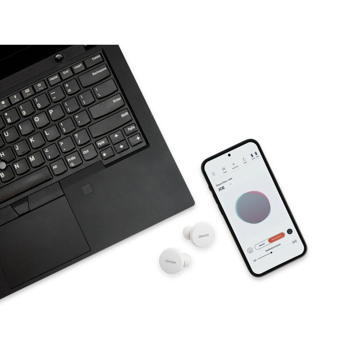 Denon PerL wireless in-ear headphones with sleek design and compact charging case, black color, on a white background.
