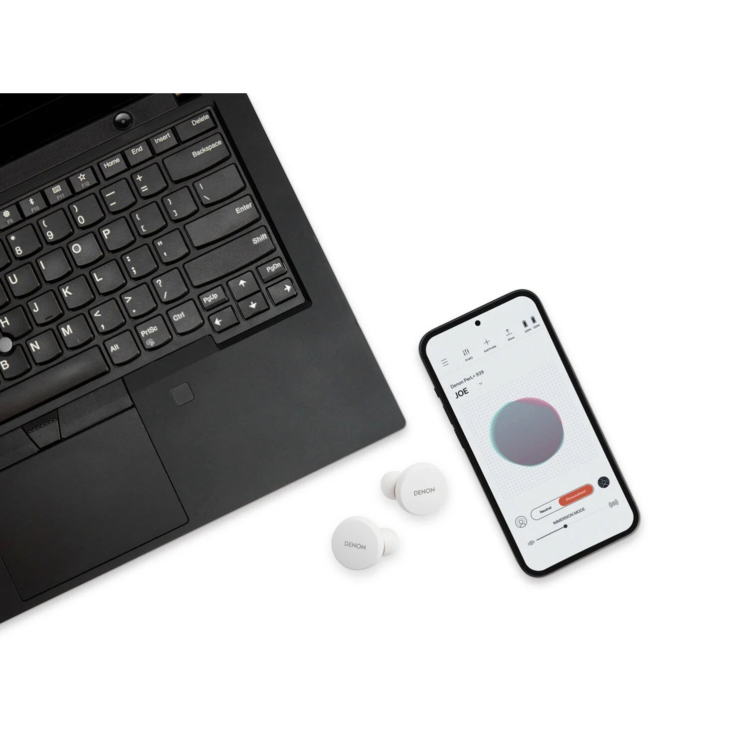 Denon PerL wireless in-ear headphones with sleek design and compact charging case, black color, on a white background.