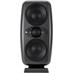 IK Multimedia iLoud MTM MK2 active nearfield monitors shown in a studio setting with sleek black finish and control knobs.