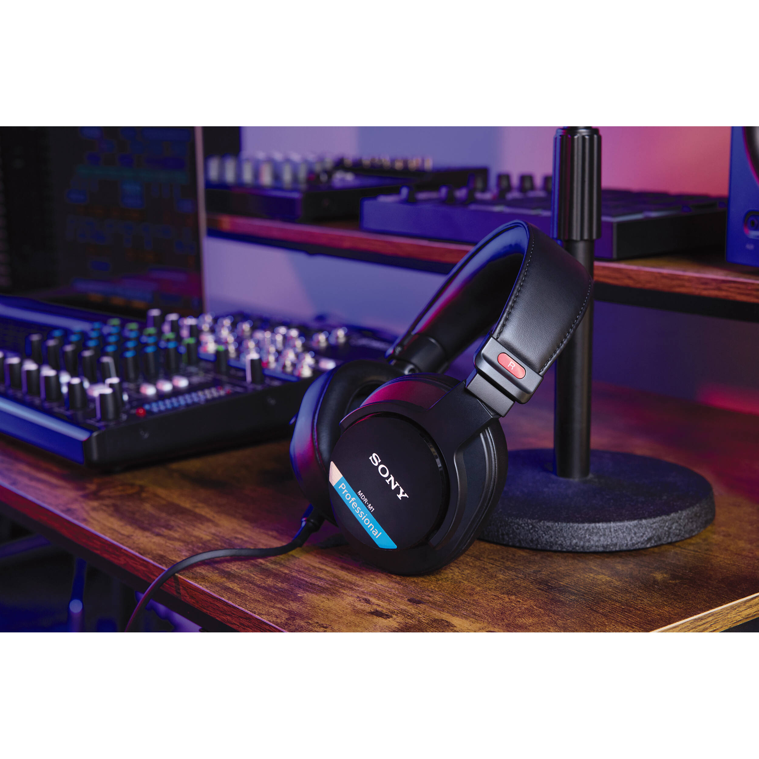 Sony MDR-M1 studio headphones shown with over-ear design, black finish, and cushioned ear pads for professional audio listening.