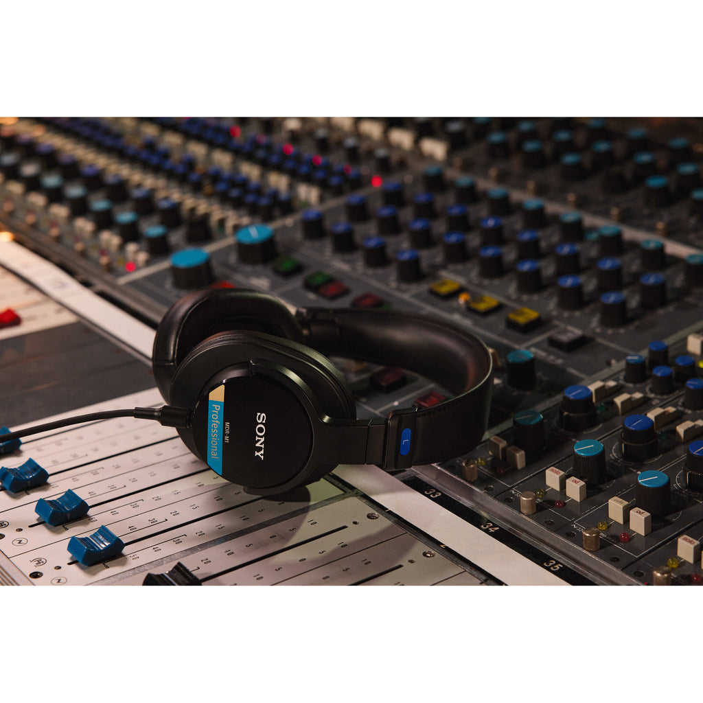 Sony MDR-M1 studio headphones with over-ear design, featuring large ear cups and padded headband for professional audio monitoring.