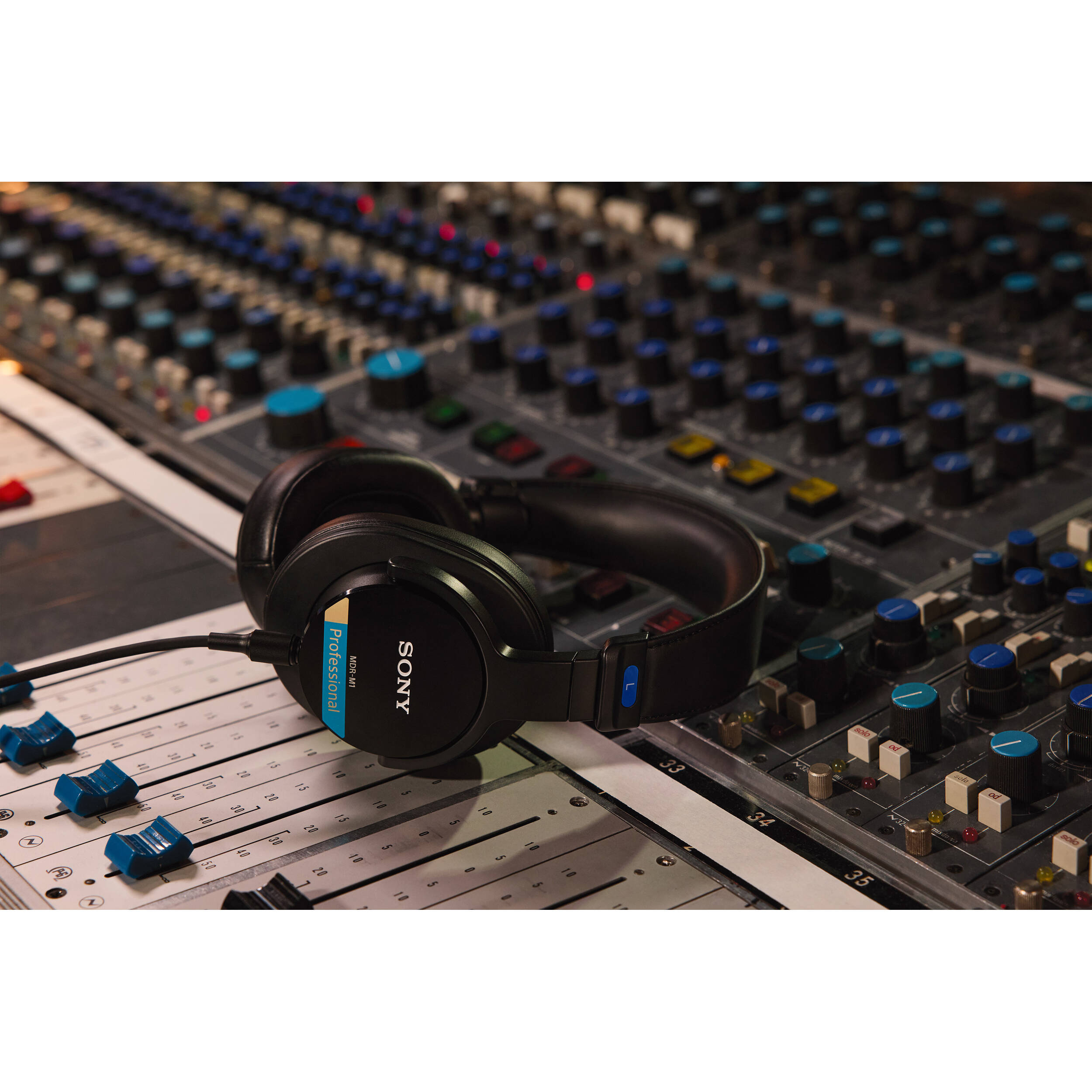 Sony MDR-M1 studio headphones with over-ear design, featuring large ear cups and padded headband for professional audio monitoring.