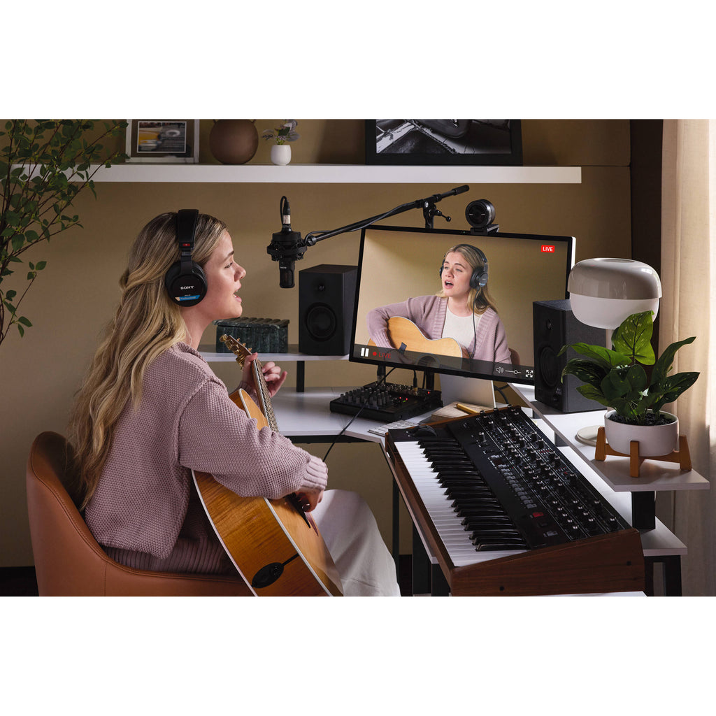 Sony MDR-M1 studio headphones with over-ear design, black color, and cushioned ear cups for professional audio monitoring.