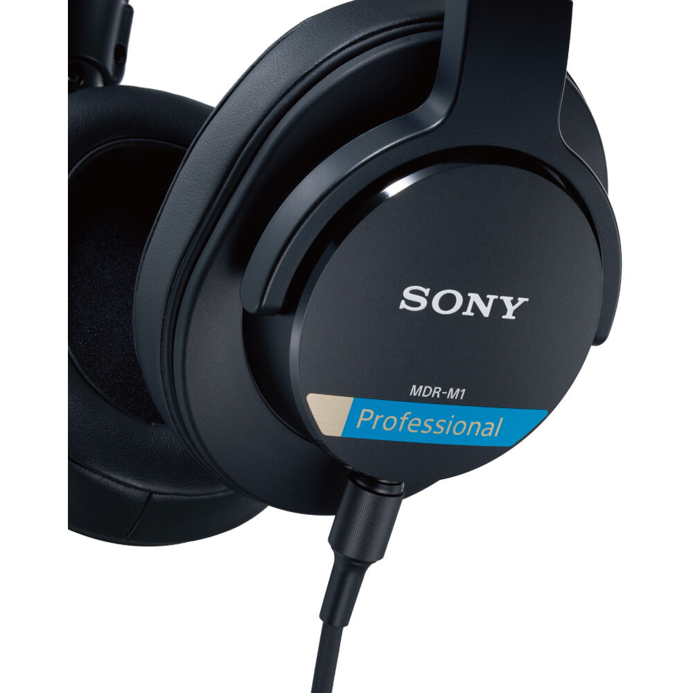 Sony MDR-M1 studio headphones shown with over-ear design, plush ear cushions, and adjustable headband for professional audio listening.
